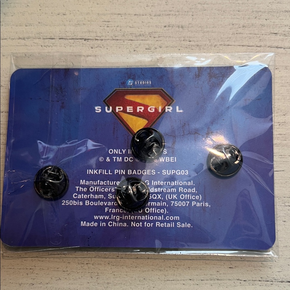 Warner Bros. Supergirl Enamel Pin Set - Black, Pink, Gold, Blue - Picture 2 of 2